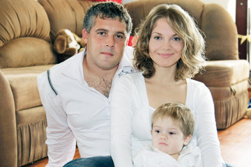 Fototapeta premium young loving family at home