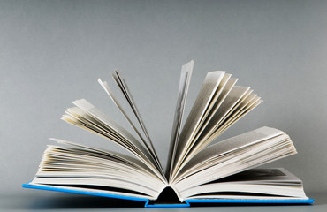 Stack of books on the color background