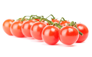 Cluster of cherry tomatoes on the white