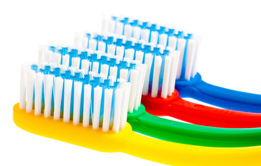 Multicolor toothbrushes isolated on white
