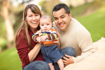 Happy Mixed Race Family Posing for A Portrait