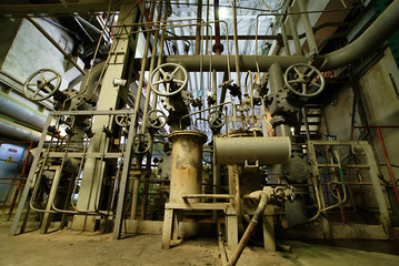 Equipment, cables and piping as found inside of a modern industr