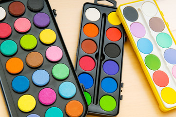 Art concept with painters palette and paint brush