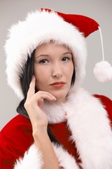 Portrait of young woman in Santa costume