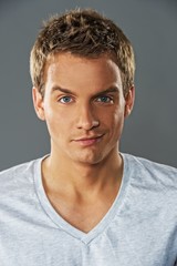 Fototapeta premium Close-up portrait of a young handsome man