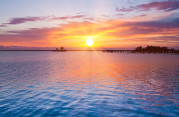 Dramatic sunrise over river pier. Indian river, Florida, USA - 27083771