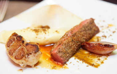 Red lamb meat on plate