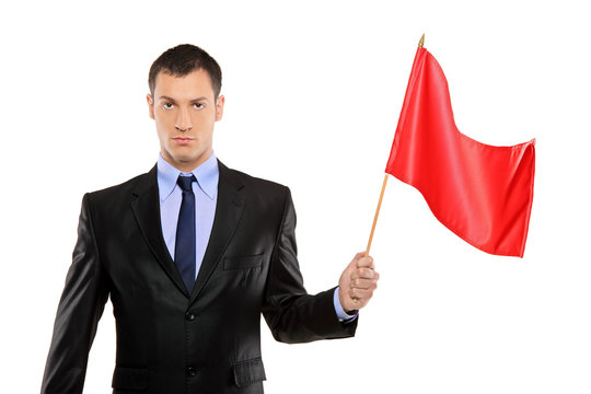 Portrait Of A Young Man Holding A Red Flag