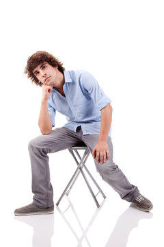 young man, sitting on a bench