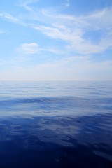 Fototapeta na wymiar Calm sea blue water ocean sky horizon scenics