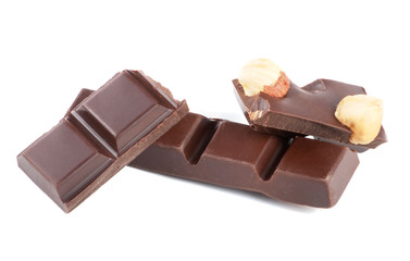 Pieces of chocolate with nuts isolated on white background