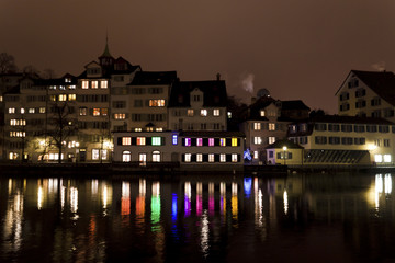 Fototapeta na wymiar City lights by the river in Zurich, Switzerland