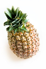 Whole fresh pineapple on white background