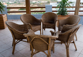Wicker chairs on the balcony.