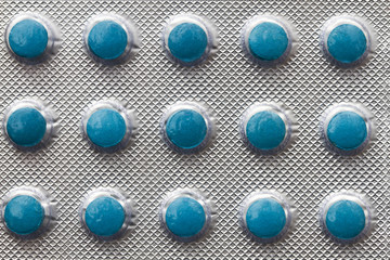 Blister pack with blue pills, close-up