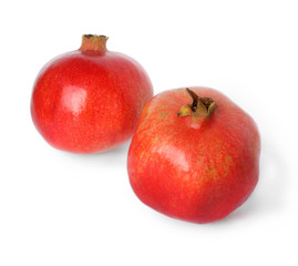 Two ripe pomegranate on a white background