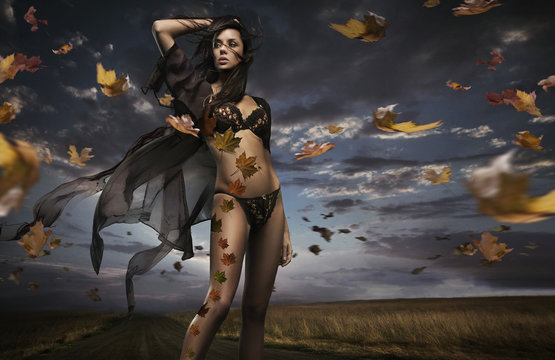 Fine art photo of a beauty lady in the autumn scenery