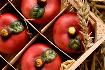 closeup of clay apples in a box