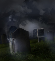 Fototapeta na wymiar Ghostly man wandering in an old cemetery