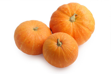 Three pumpkins isolated on white background