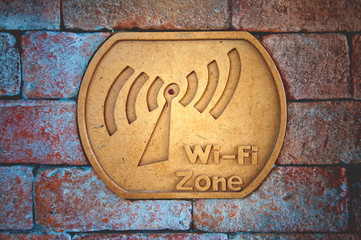 Wifi notice on brick wall