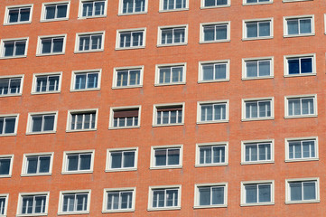 Windows on the red brick wall