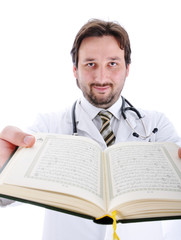 Muslim doctor with Koran in hands showing you