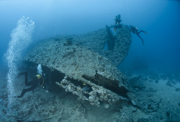 Scuba diver entering a shipwreck.