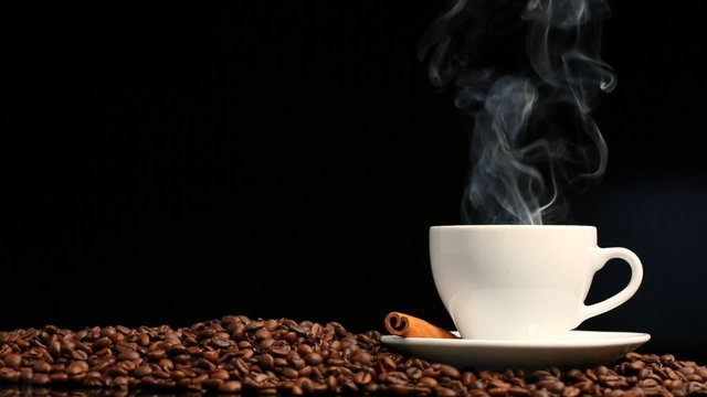 Cup of coffee on black background