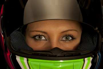 Female motorcycle driver with helmet on