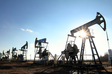Fototapeta na wymiar working oil pumps silhouette in row