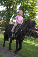 little girl riding