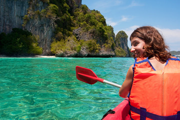 Girl kayaking in the sea near Phi-Phi