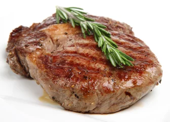 Photo sur Plexiglas Steakhouse Steak de faux-filet assaisonné et cuit