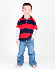Young boy posing with hand in pocket