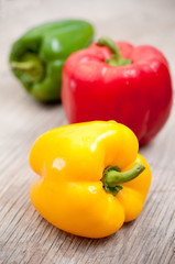 Bell peppers on wooden surface