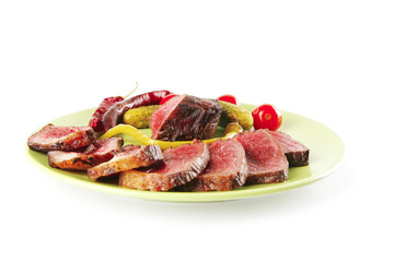 red beef slices on green dish