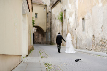 Bride and groom walking away