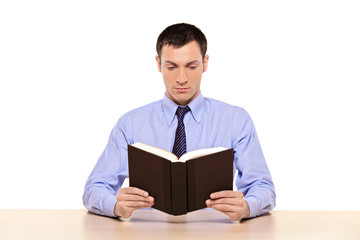 Young man reading a book