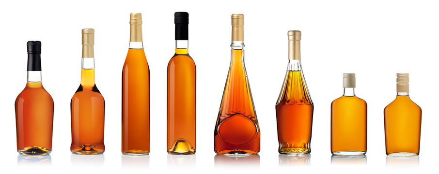 Fototapeta Set of brandy bottles isolated on white background