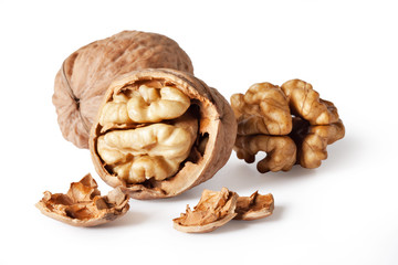 walnut and a cracked walnut isolated on the white background