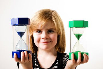 child holding timers