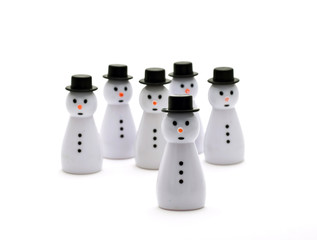 six plastic snowmen isolated over white