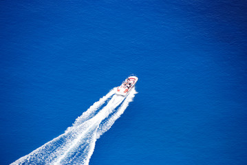 Blue sea, powerboat, white wave
