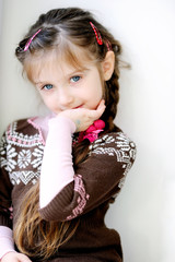 Beauty small girl with long dark braid