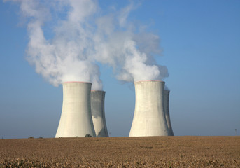 fourcooling tower of nuclear power plant and agriculture field
