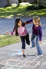 Girls playing hopscotch