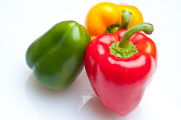 Macro shot of colorful bell peppers isolated on white