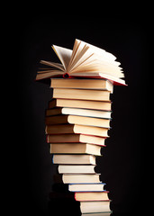 Pile of books on a black background