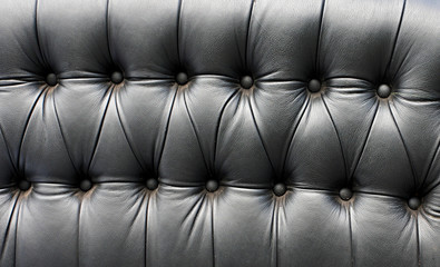 Black leather seat in an old car (close-up)